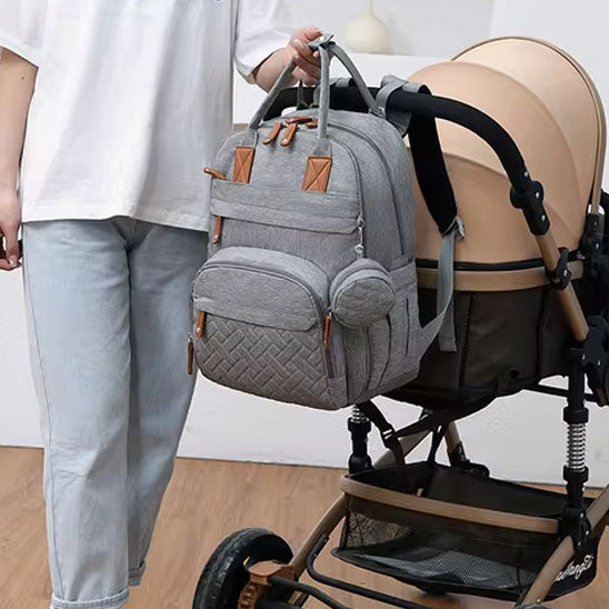 sac à dos à langer avec sangle de poussette