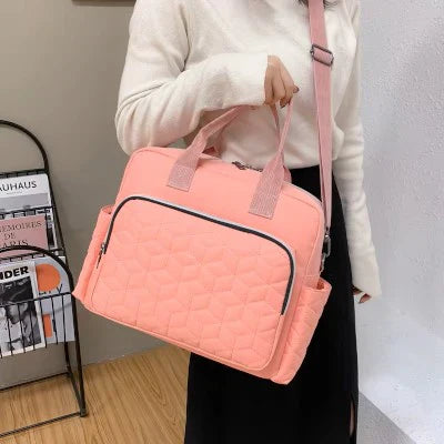 maman porte sac a langer en bandouliere
